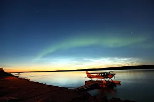 Aurora Borealis Over The Mackenzie River With Float Planes In Foreground, Fort Simpson, Northwest Territories Aurora Borealis Over The Mackenzie River With Float Planes In Foreground, Fort Simpson, Northwest Territories