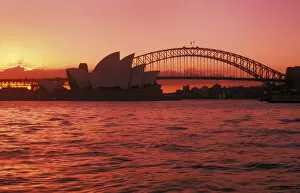 Urban Scene Gallery: Australia, New South Wales, Opera House and Harbor Bridge at sunset; Sydney