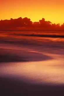 Images Dated 3rd February 2004: Beach At Sunset With Gentle Wave Rolling In, Dark Orange Sky With Silver Reflections On Water