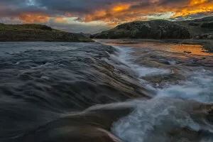 Beautiful sunset over a stream in rural Iceland; Iceland