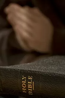 Images Dated 10th June 2006: Bible With Praying Hands In Background