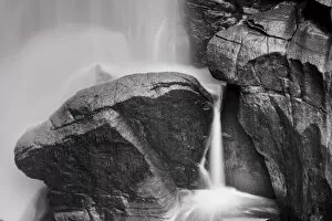 Black and white image of a cascading waterfall over rocks, Washington, USA