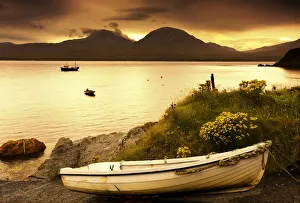 Boat On The Shore At Sunset, Island Of Islay, Scotland Boat On The Shore At Sunset, Island Of Islay, Scotland