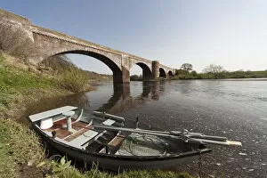 Images Dated 9th April 2011: A Boat Along The Shoreline Beside A Bridge In River Tweed; Scottish Borders Scotland