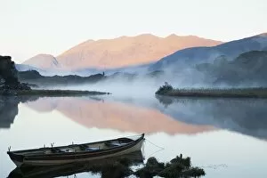 Images Dated 12th October 2010: Boat On A Tranquil Lake; Killarney National Park, Killarney, County Kerry, Ireland