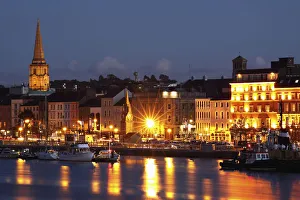 Boats Moored On River Suir At City Waterfront At Night; Waterford City, County Waterford Boats Moored On River Suir At City Waterfront At Night; Waterford City, County Waterford