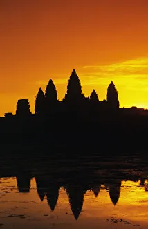 Cambodia, Siem Reap, Angkor Wat, Silhouette Of Temple At Sunrise, Reflections On Water Surface, Ornage Sky Cambodia, Siem Reap, Angkor Wat, Silhouette Of Temple At Sunrise, Reflections On Water Surface, Ornage Sky