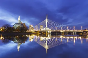 Canadian Museum For Human Rights And Esplanade Riel Bridge Reflected In The Red River; Winnipeg, Manitoba, Canada Canadian Museum For Human Rights And Esplanade Riel Bridge Reflected In The Red River; Winnipeg, Manitoba, Canada