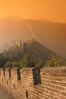 China, The Great Wall At Hazy Orange Sunset