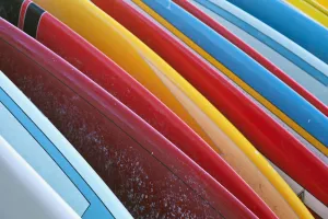 Close Up Of Coloured Surfboards Lined Up; Honolulu, Oahu, Hawaii, United States Of Close Up Of Coloured Surfboards Lined Up; Honolulu, Oahu, Hawaii, United States Of