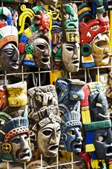 Close Up Of Colourfully Painted Mayan Masks Hanging On Display; Akumal, Quintana Roo, Mexico Close Up Of Colourfully Painted Mayan Masks Hanging On Display; Akumal, Quintana Roo, Mexico