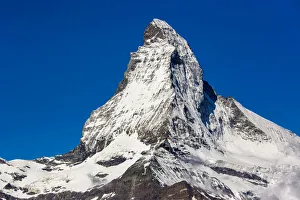 Close-up of the snow covered Matterhorn summit in spring on a sunny day at Zermatt, Switzerland Close-up of the snow covered Matterhorn summit in spring on a sunny day at Zermatt, Switzerland