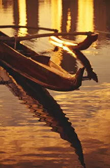 Images Dated 13th March 2000: Closeup Of Koa Outrigger Canoe On Water With Reflection Of Golden Sunset