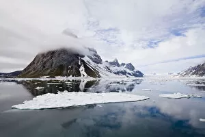 Ice Cap Gallery: Clouds are reflected in clear arctic waters