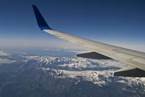 Images Dated 2nd June 2008: A Commercial Jet Flies Over The Mountains Of The American West; Colorado, United States Of America