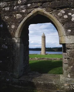 Devenish Monastic Site, Lower Lough Erne, Ireland; Medieval Monastic Site With Round Tower In The Distance Devenish Monastic Site, Lower Lough Erne, Ireland; Medieval Monastic Site With Round Tower In The Distance