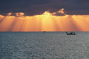 Dramatic Sky With Sun Rays Filtering Down Out Of The Storm Clouds Over The Horizon; Paphos Dramatic Sky With Sun Rays Filtering Down Out Of The Storm Clouds Over The Horizon; Paphos