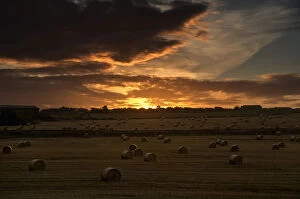 Images Dated 25th August 2014: Dramatic Sunset With Dark Clouds Over A Field With Hay Bales; Whitburn, Tyne And Wear, England