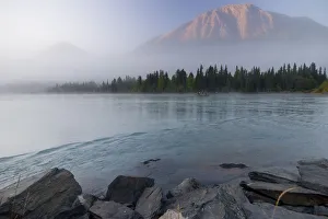 Drift Boat On The Outlet Of Kenai Lake Near Cooper Landing With Cecil Mountain Shrouded In Fog In The Background Drift Boat On The Outlet Of Kenai Lake Near Cooper Landing With Cecil Mountain Shrouded In Fog In The Background