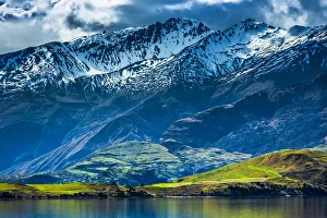 Farmland along the lake shore with moutain range at Glendhu Bay in the Otago Region of New Zealand Farmland along the lake shore with moutain range at Glendhu Bay in the Otago Region of New Zealand