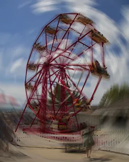 Ferris Wheel At Amusement Park, Motion Blur; Calgary, Alberta, Canada Ferris Wheel At Amusement Park, Motion Blur; Calgary, Alberta, Canada