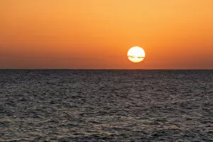 Images Dated 9th November 2014: Glowing Sun Over The Ocean And Horizon At Sunset; Paphos, Cyprus