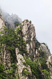 Granite Peaks With Pine Trees In The North Sea Scenic Area, Mount Huangshan, Anhui, China Granite Peaks With Pine Trees In The North Sea Scenic Area, Mount Huangshan, Anhui, China