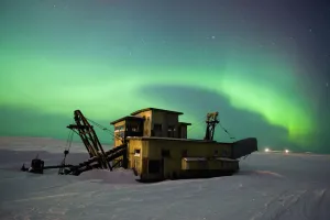Green Northern Lights Dance Over A Historical Gold Dredge Near Nome, Alaska Green Northern Lights Dance Over A Historical Gold Dredge Near Nome, Alaska