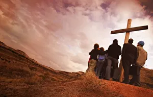 A Group Of People Standing At The Base Of A Large Wooden Cross A Group Of People Standing At The Base Of A Large Wooden Cross