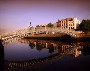 Images Dated 3rd July 2007: Ha penny Bridge, River Liffey, Dublin, Ireland; Bridge Reflected In River Against Cityscape