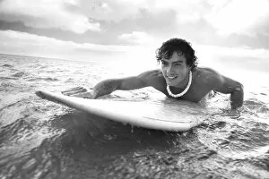 Images Dated 29th November 2009: Hawaii, Oahu, Young Man Paddling On His Surfboard In The Water