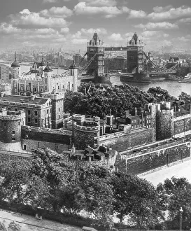 Historic image in black and white of the Tower Bridge over River Thames and cityscape of London Historic image in black and white of the Tower Bridge over River Thames and cityscape of London