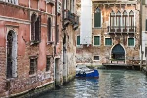 Historical buildings line a canal in Venice, Italy Historical buildings line a canal in Venice, Italy