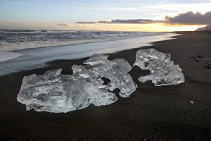 Ice from the Jokulsarlon glacier lagoon washed up on a black sand beach Ice from the Jokulsarlon glacier lagoon washed up on a black sand beach