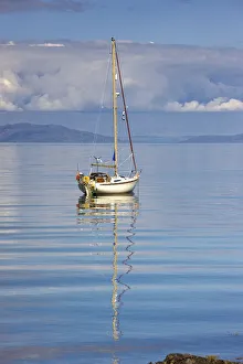 Isle Of Colonsay, Scotland; Sailboat On The Ocean Isle Of Colonsay, Scotland; Sailboat On The Ocean