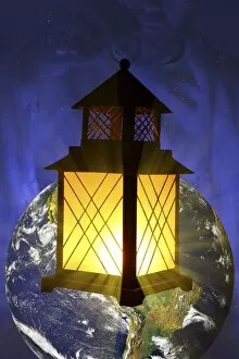 Images Dated 20th March 2008: Lantern On A Picture Of The Earth