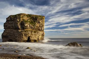 A Large Rock Formation Off The Coast; South Shields, Tyne And Wear, England A Large Rock Formation Off The Coast; South Shields, Tyne And Wear, England