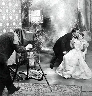 A life model stereoview from 1900 of a bride and groom having their photograph taken A life model stereoview from 1900 of a bride and groom having their photograph taken