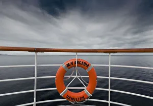 A Life Preserver Hanging From The Railing On A Boat; Norway A Life Preserver Hanging From The Railing On A Boat; Norway