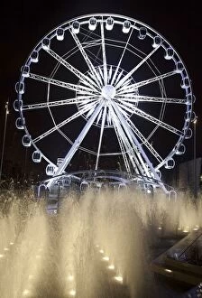Images Dated 13th February 2010: Middlesbrough, North Yorkshire, England; A Ferris Wheel And Fountains Illuminated At Night