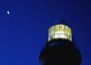 Images Dated 8th February 2005: Moon Crescent Above Lighthouse At Dusk, Low Angle View, Close Up