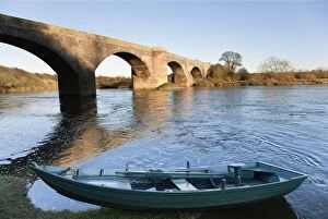 Images Dated 30th January 2010: Northumberland, England; A Boat Moored On The Edge Of A River With A Bridge