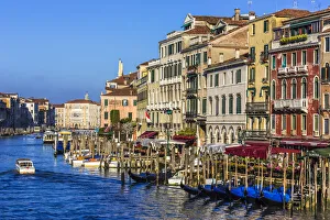 Overview of the historical buildings along the Grand Canal on a sunny morning in Venice, Italy Overview of the historical buildings along the Grand Canal on a sunny morning in Venice, Italy