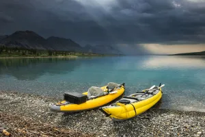 A Pair Of Yellow Inflatable Kayaks On The Lower Twin Lake Beach With A Summer Thunderstorm In The Background A Pair Of Yellow Inflatable Kayaks On The Lower Twin Lake Beach With A Summer Thunderstorm In The Background