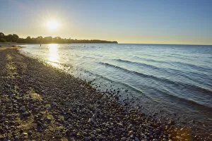 Pebble beach with Sun in Summer, Sunset, Dronningmolle, Hovedstaden, Baltic Sea, Zealand, Denmark