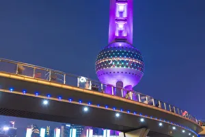 Detail of a pedestrian overpass and the Oriental Pearl Tower at dusk; Shanghai, Shanghai Shi, China Detail of a pedestrian overpass and the Oriental Pearl Tower at dusk; Shanghai, Shanghai Shi, China