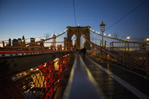 Pedestrian Path On Brooklyn Bridge Heading Into Manhattan At Night; New York City, New York, United States Of America Pedestrian Path On Brooklyn Bridge Heading Into Manhattan At Night; New York City, New York, United States Of America