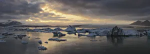 Pieces of ice calves floating in glacial lagoon jokulsarlon at twilight; iceland Pieces of ice calves floating in glacial lagoon jokulsarlon at twilight; iceland