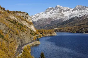 Road along Lake Sils in Autumn, Piz Surlej and Munt Arlas, St Moritz, Maloja District, Engadin, Graubunden, Switzerland Road along Lake Sils in Autumn, Piz Surlej and Munt Arlas, St Moritz, Maloja District, Engadin, Graubunden, Switzerland