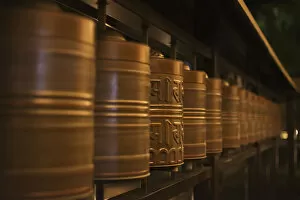 Images Dated 28th October 2014: Row Of Spinning Prayer Wheels At Night, One Is Stopped; Kyoto, Japan
